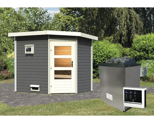 Sauna avec poêle de sauna et unité de contrôle dans le jardin