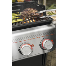 Grill avec steak et asperges retourné à la pince