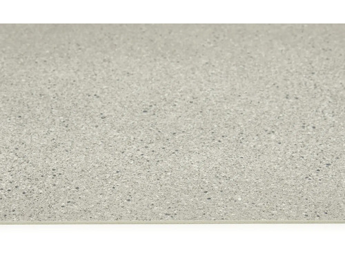 Nahaufnahme einer Bodenfliese mit gesprenkelter Oberfläche