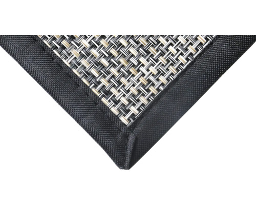 Detailansicht einer Tischmatte mit Textilmuster und Bordüre