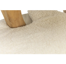 Detailansicht eines Hockers mit Holzbein und Fellbezug