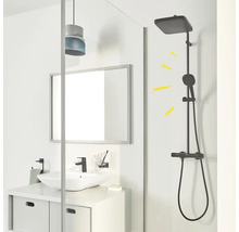 Salle de bain avec lavabo, miroir et colonne de douche