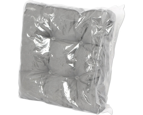 Coussin de chaise gris à boutons dans un emballage transparent