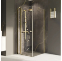 Cabine de douche avec robinetterie et porte-serviettes dans la salle de bains