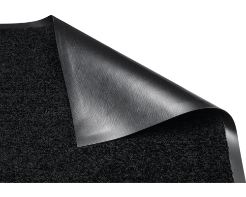 Tapis de propreté avec un coin enroulé pour montrer l''arrière