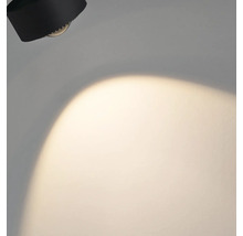 Schwarze Wandleuchte mit Lichtkegel