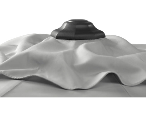 Detailansicht einer weißen Sonnenschirmhaube mit schwarzer Spitze