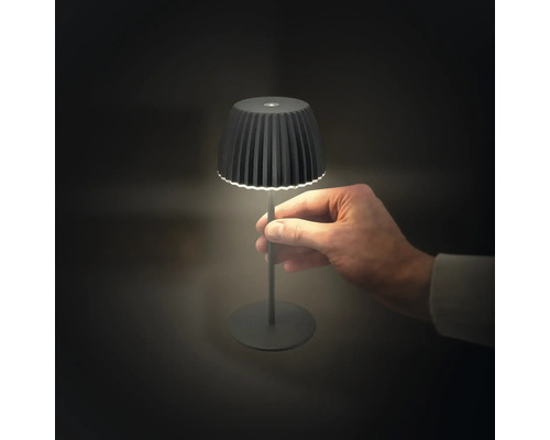 Lampe de table LED noire avec une main dans l''image