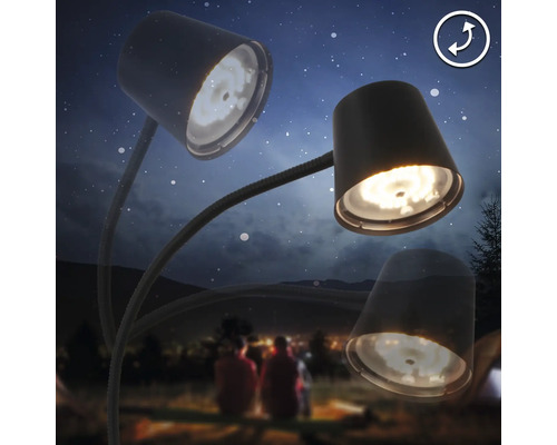 Lampe de bureau à trois bras sur fond de personnes et de tentes