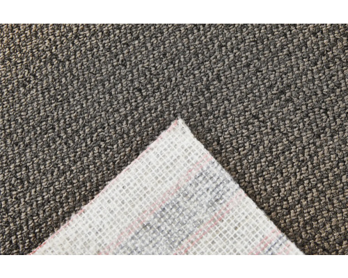 Gros plan d''un tapis gris avec une section du dessous