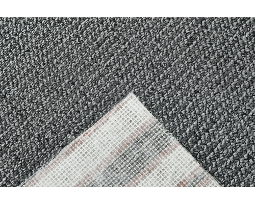 Vue détaillée d''un tapis gris avec un motif sur le dos