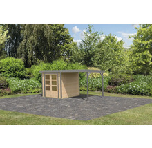 Abri de jardin avec carport sur pavés dans le jardin