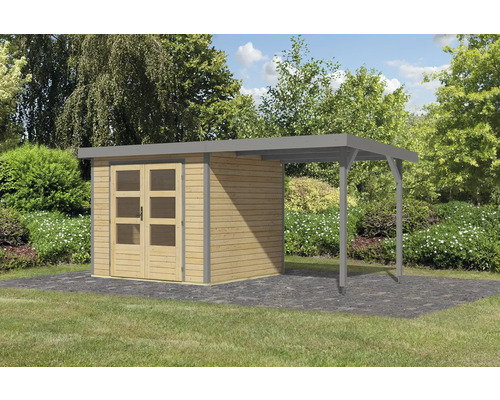 Abri de jardin en bois avec annexe sur pelouse