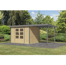 Abri de jardin avec annexe sur pelouse devant des arbres