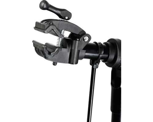 Detailaufnahme einer Fahrradreparaturklemme auf einem Montageständer