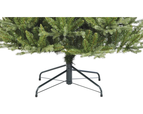 Gros plan sur un sapin de Noël artificiel avec pied en métal