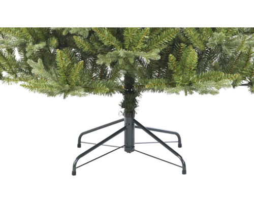 Vue détaillée d''un sapin de Noël artificiel avec un pied en métal