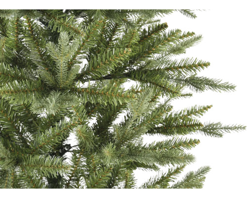 Gros plan sur un sapin de Noël artificiel avec des aiguilles vertes