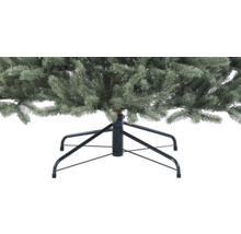 Gros plan d''un arbre de Noël artificiel avec un pied en métal