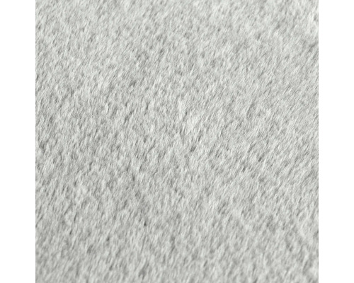 Detailaufnahme eines grauen Teppichs