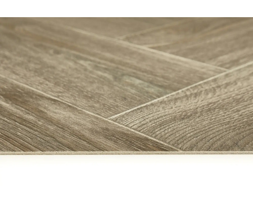 Nahaufnahme eines Vinylbodens in Fischgrätenmuster