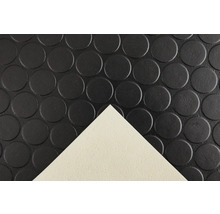 Tapis en caoutchouc avec motif à picots et un coin déplié.