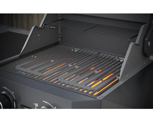 Vue détaillée d''un barbecue à gaz avec grille et étagère de maintien au chaud