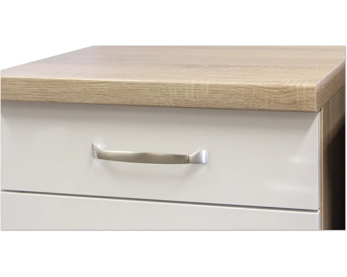 Detailaufnahme eines Schranks mit Schubladen und Griff