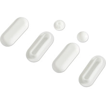 Plusieurs capsules et pilules blanches