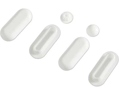 Plusieurs capsules et pilules blanches