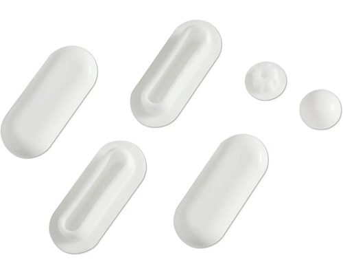 Plusieurs capsules et comprimés blancs