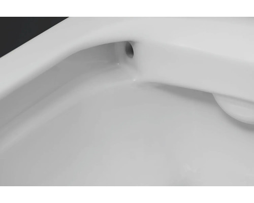 Gros plan d''un lavabo en céramique blanche avec trop-plein