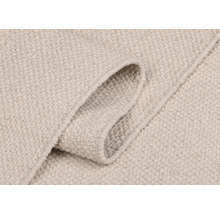 Gros plan d''un tapis de couleur claire avec motif textile