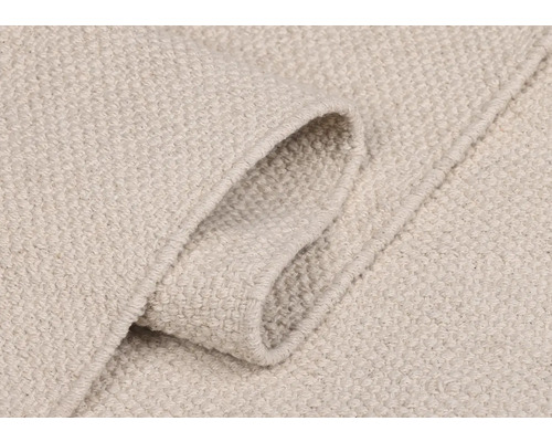 Gros plan d''un tapis de couleur claire avec motif textile