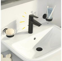 Modernes Badezimmerwaschbecken mit schwarzer Armatur, Seifenschale und Zahnbürstenhalter