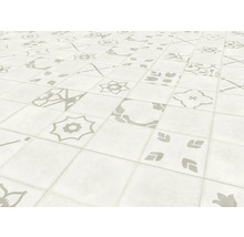 Sol carrelé avec différents motifs.