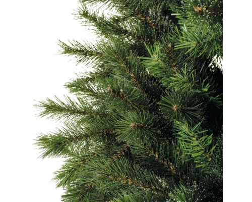 Gros plan sur un arbre de Noël artificiel avec des aiguilles vertes