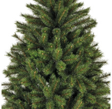 Gros plan d'un arbre de Noël artificiel avec des aiguilles vertes.