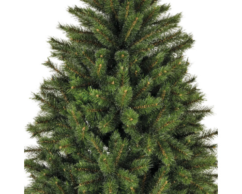 Gros plan d'un arbre de Noël artificiel avec des aiguilles vertes.