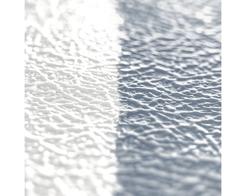 Gros plan d''une surface d''enduit structuré