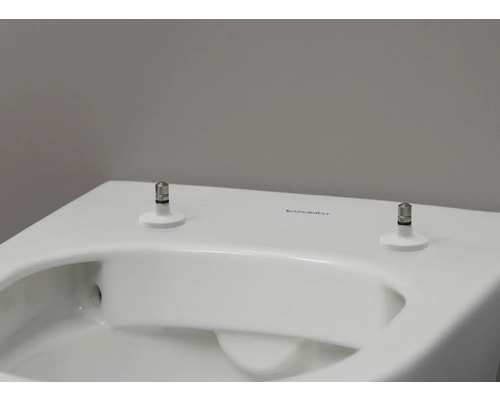 Vue détaillée de toilettes Duravit blanches avec fixation