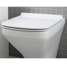 WC à fond creux suspendu avec couvercle de WC fermé devant un mur carrelé