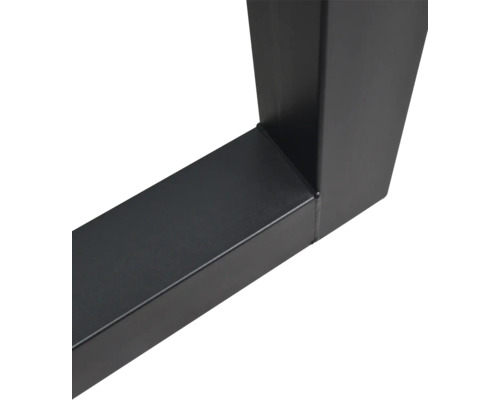 Gros plan d'un piètement de table en métal noir avec profilé carré et soudure.