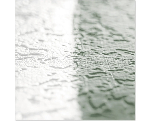 Nahaufnahme einer Wand mit Reibeputzstruktur