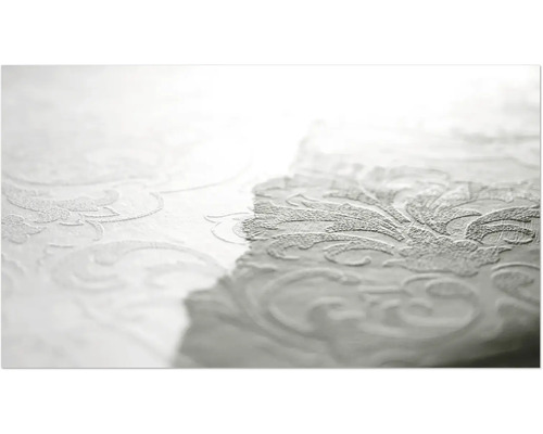 Gros plan d'un papier peint blanc avec un motif floral