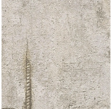 Gros plan d'une surface d'enduit texturée