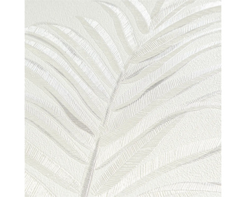 Gros plan d'un papier peint vinyle blanc avec motif de feuilles de palmier