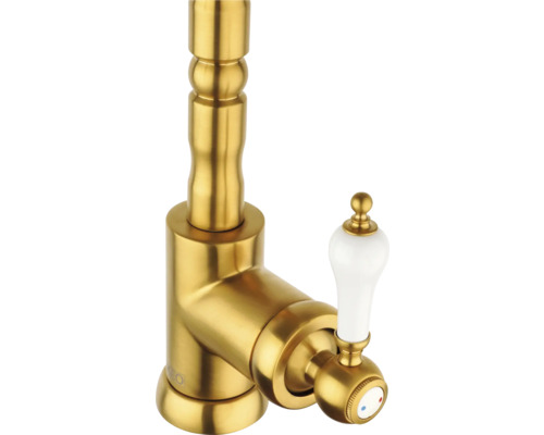 Goldfarbene Waschtischarmatur mit weißem Griff