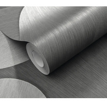 Eine Rolle Tapete mit einem abstrakten Kreisdesign.