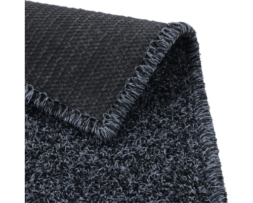 Vue détaillée d'un tapis de propreté gris avec une texture tissée